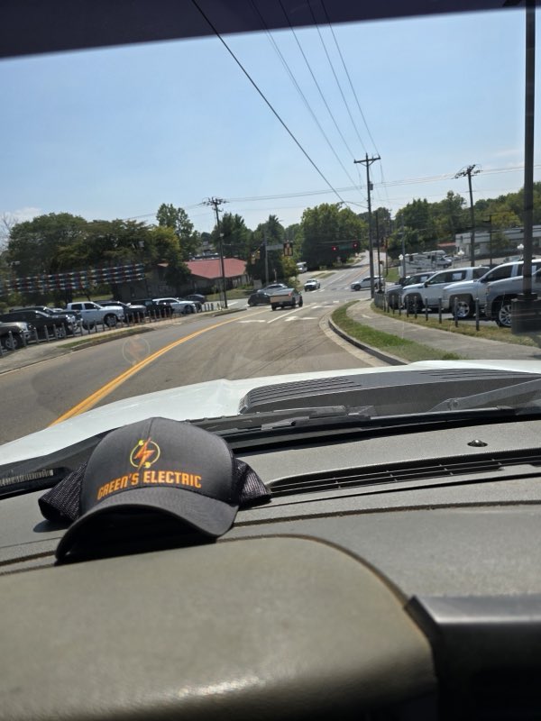 Green's Electric work truck and cap